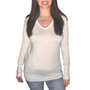Long sleeve vneck top with buttons on the sleeves